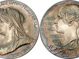 a close up of a coin with a woman ' s face on it