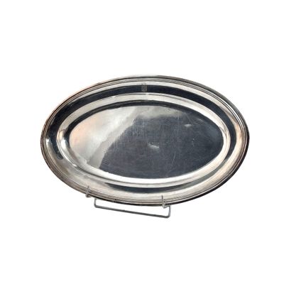 a silver plate on a stand on a white background