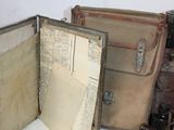 two open suitcases sitting on a table next to each other