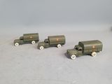 three toy trucks that are sitting next to each other