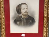 painting of a man with a beard in a gold frame on a easel