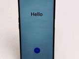 a close up of the back of a phone with a hello button on it
