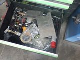 a metal tool box filled with assorted tools