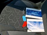 a picture of a car seat with a car key in it