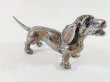 statue of a dachshund dog on a white background