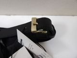 a black belt with a gold buckle next to a pair of scissors