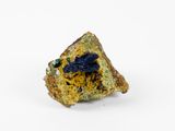 a close up of a piece of rock with blue and yellow crystals