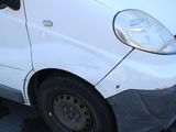 a white van that is parked on the side of the road