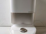 an image of a water dispenser sitting on top of a laptop