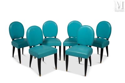 four blue leather dining chairs with black legs and a white background