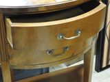 a wooden table with a drawer on top of it