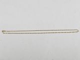 a gold necklace with a chain that has been cut in half