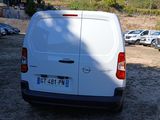 a white van that is parked in a parking lot
