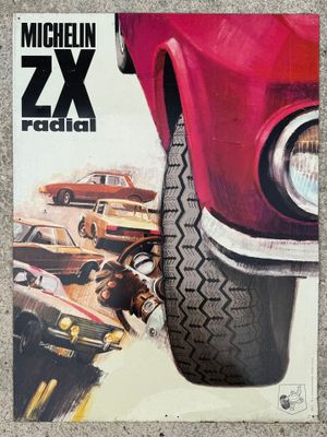 the front cover of a magazine with a picture of a red car
