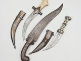 three different types of knifes are displayed on a white surface