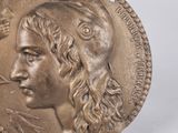 an image of a gold coin with a man ' s face on it