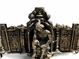 une statue représentant un homme assis sur un banc