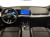 the interior of a car with a steering wheel, dashboard, and display screen