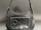 grey leather purse with a metal buckle on the front