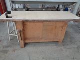 a wooden workbench in a garage with a counter top on it