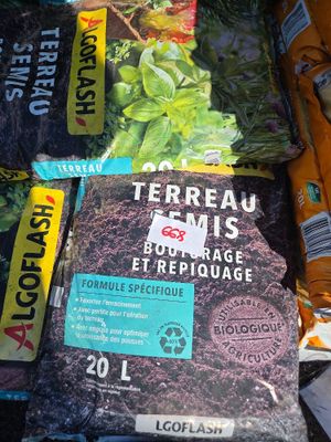 many different types of seeding and seeding bags on the ground