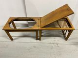 an image of a wooden bench with a glass top on a floor
