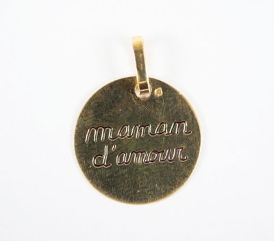 a close up of a gold pendant with the words mountain of ammon