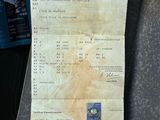 a picture of a receipt sitting on the seat of a car