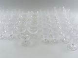 a lot of empty wine glasses sitting on a table