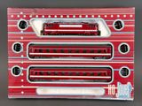 three red train cars sitting on top of each other