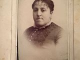 an old photo of a woman in a black and white photo