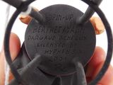 a person holding a black object in their hand