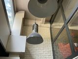 two lamps hanging from the ceiling in a room
