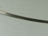 a small sword that is sitting on a table