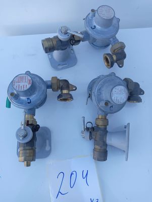four different types of gas valves on a table with a price tag