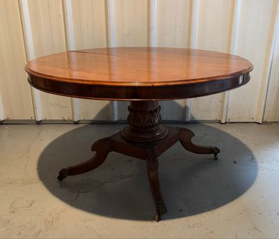 an image of a round table with a wooden top