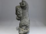 sculpture of a woman holding a child in her arms