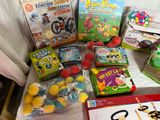 many toys and games on the table for children to play