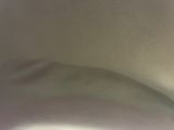 a close up of a white toilet with a blurry background