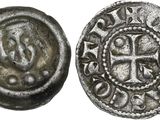 une pièce de monnaie en argent portant l'image d'une croix