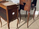 two wooden tables with drawers on them on a tiled floor