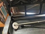 a wooden bench with a baseball bat and a baseball bat on it