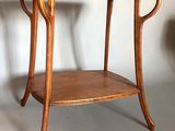 a wooden table with a shelf underneath it