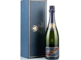 a bottle of champagne in front of a blue box
