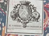 a picture of a book with a picture of a coat of arms on it