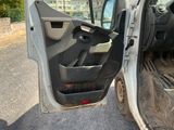 a car door open with the driver ' s seat down