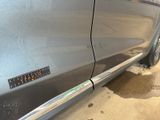 a close up of a car door with a sticker on it