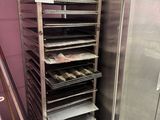 an image of a commercial oven with trays of food in it