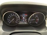 a close up of a car dashboard with a speedometer and gauges