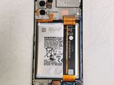 a close up of a cell phone with a battery attached to it
